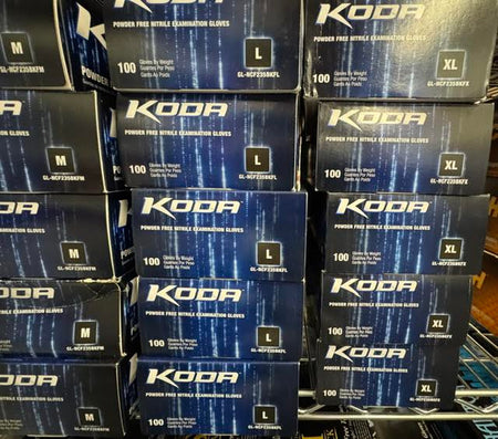 Boxes of Adenna Koda light blue nitrile powder-free medical examination gloves at Lexicon Medical Supply. 