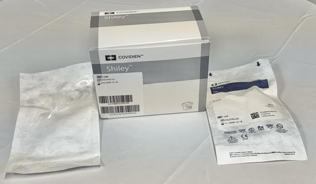 A box of Shiley decannulation caps compatible with FEN and CFN tracheostomy tubes.
