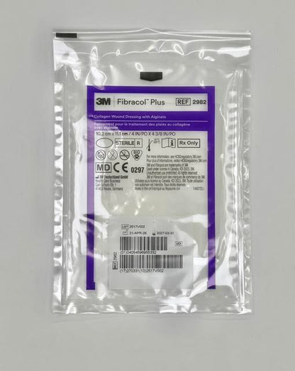 An individual sterile peel pouch packet of a 3M Fibracol Plus 2982 collagen and alginate wound dressing pad.