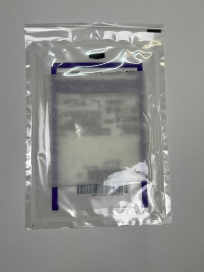 Close up view of the porous texture of an unboxed Fibracol Plus 2982 collagen alginate absorbent dressing pad.