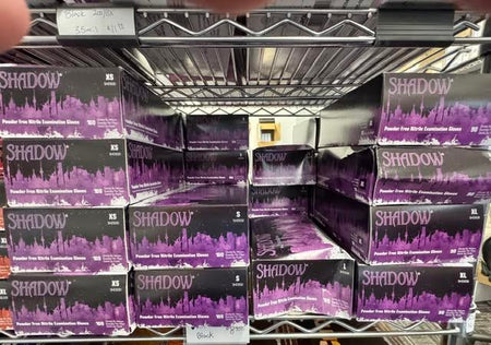 Boxes of Adenna Shadow black nitrile powder-free examination gloves at Lexicon Medical Supply.