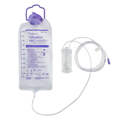 An unboxed Cardinal Health B10FD feeding set displaying the large 1000 mL graduated bag, integrated tubing, and proprietary OMNI pump cassette.