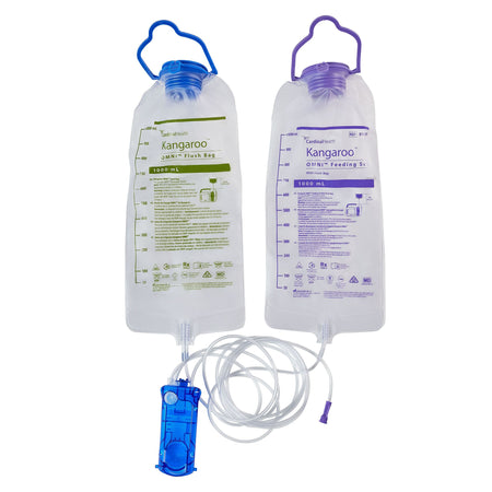 An unboxed Cardinal Health B10FF set displaying the large 1000 mL feed bag, smaller 500 mL flush bag, clear tubing, and teal OMNI cassette.